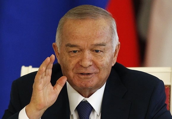 Uzbekistan's President Karimov gestures during a signing ceremony after talks with his Russian counterpart Putin at the Kremlin in Moscow
