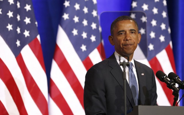 U.S. President Barack Obama is seen through a teleprompter as he speaks about the National Security Agency from the Justice Department in Washington