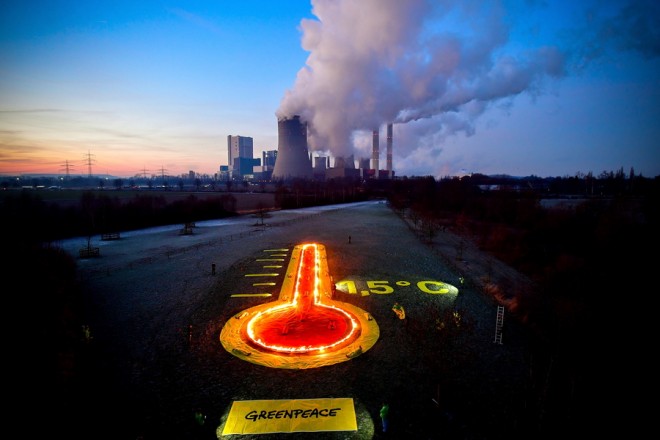 epa07308197 Greenpeace activists display a thermometer installation in front of the brown coal-fired power plant Niederaussem operated by RWE in Bergheim, 22 January 2019. The Rhenish Brown Coal Field is Europe's largest carbon dioxide source. Greenpeace activists demanded for a better climate protection. EPA/SASCHA STEINBACH