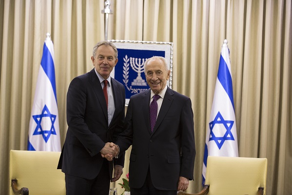 Israel's President Shimon Peres shakes hands with Tony Blair before their meeting with in Jerusalem