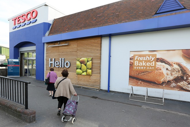 Shoppers go into a Tesco store in Bow, east London