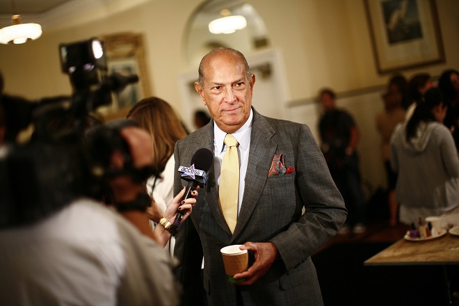 Fashion designer  Oscar De La Renta talks to reporters prior to the showing of his Spring 2009 collection during New York Fashion Week