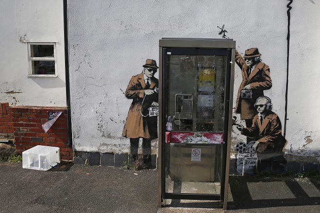 Graffiti art is seen on a wall near the headquarters of Britain's eavesdropping agency, GCHQ, in Cheltenham, western England