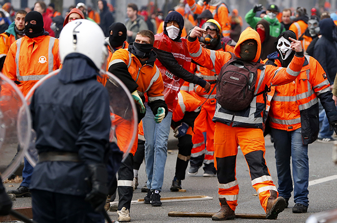 Demonstrators confront riot police in central Brussels