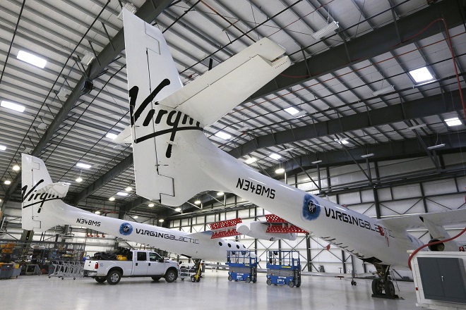 Virgin Galactic's WhiteKnightTwo carrier aircraft mothership, which landed safely after splitting from SpaceShipTwo, is seen in a hangar at Mojave Air and Space Port in Mojave, California