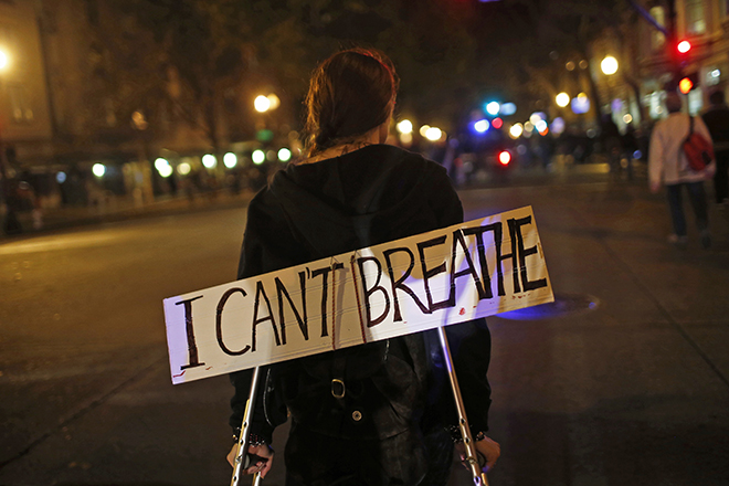 Protesters march against the New York City grand jury decision to not indict in the death of Eric Garner, in Oakland, California