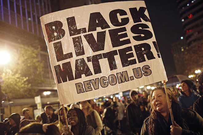 Protesters march against the New York City grand jury decision to not indict in the death of Eric Garner, in Oakland, California