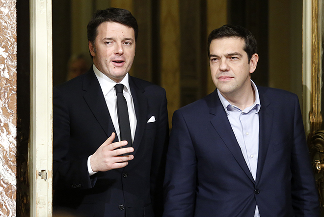 Italian Prime Minister Renzi talks with his Greek counterpart Tsipras as they arrive for a news conference at Chigi palace in Rome
