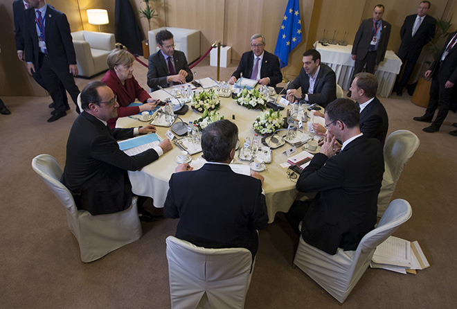 French President Hollande, German Chancellor Merkel, Eurogroup Chairman Dijsselbloem, European Commission President Juncker, Greek Prime Minister Tsipras, European Council President Tusk and officials take part in a meeting during a European Union leaders