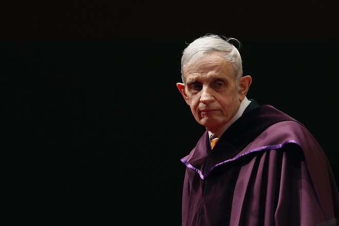 U.S. mathematician and Nobel Laureate John Nash, 83, stands on the podium as he receives an Honorary Doctor of Science at the City University of Hong Kong November 8, 2011. Nash came up with the concept of "Nash Equilibrium", used in game theory.  REUTERS/Bobby Yip (CHINA - Tags: EDUCATION SOCIETY) - RTR2TQNX