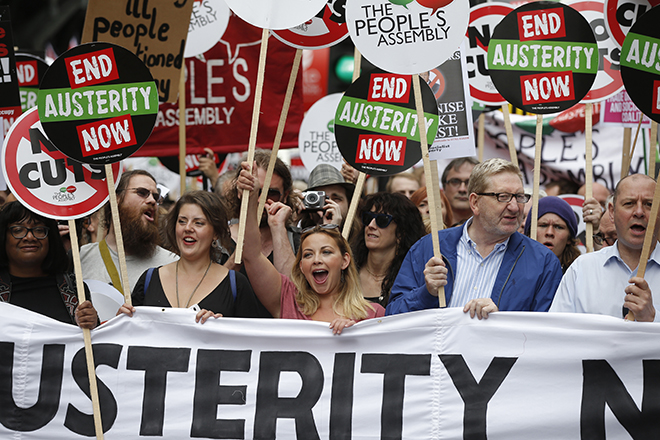 British singer Charlotte Church (C) and Len McCluskey, head of the Unite union (2nd right), hold a banner as they march during an anti-austerity protest in central London, Britain June 20, 2015.  REUTERS/Peter Nicholls  - RTX1HD7K
