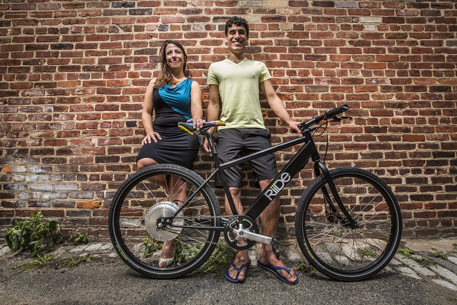 WASHINGTON, DC. JULY 29, 2014: Founders of Riide electric bike start-up, Amber Watson and Jeffrey Stefanis, in the alley outside their office / assembly space in a row house in Washington, DC. on July 29,2014 .( Photo by Jeffrey MacMillan )