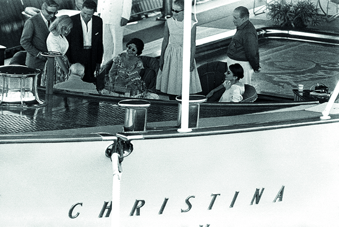 Aristotle Onassis, Winston Churchill (back seated), Maria Callas and her husband Giovanni Battista Meneghini aboard "Christina O", yacht of the Greek shipping magnate Aristotle Onassis, in the port of Monaco (Principality of Monaco). In 1959. --- Image by © Georges Dudognon/Corbis