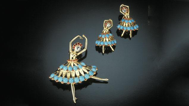 Van Cleef & Arpels ballerina brooch and matching clip earrings of gold, diamonds, turquoise and ruby.