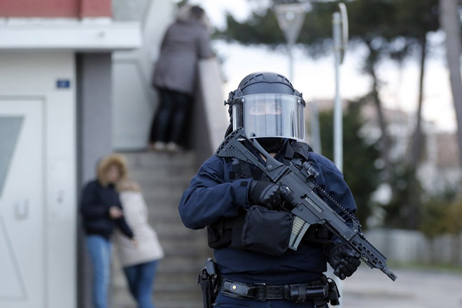 epa06624386 French Police task force BRI (Bureau Recherche Investigation) officers raid the appartment of Redouane Ladkim in the Ozanam district of Carcassonne, southern France, 23 March 2018. Ladkim was identified as the gunman claiming allegiance to the Islamic State (IS) who shot and wounded a jogging police officer before opening fire and taking hostages at a 'Super U' supermarket in the town of Trebes near Carcassonne. Three victims have been confirmed killed and and 16 others dozen injured in the attack.  EPA/GUILLAUME HORCAJUELO