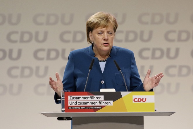 epa07214542 German Chancellor Angela Merkel holds a speech during the 31st Party Congress of the Christian Democratic Union (CDU) in Hamburg, Germany, 07 December 2018. At the party congress, a new party leader is to be elected. Associated with the new party leader is the debate over the fundamental political orientation of the CDU after Chancellor Merkel will no longer hold this office.  EPA/FOCKE STRANGMANN