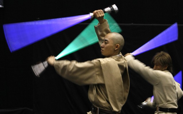 Participants dressed as Jedi Knights perform at "Star Wars Celebration Japan' in Chiba