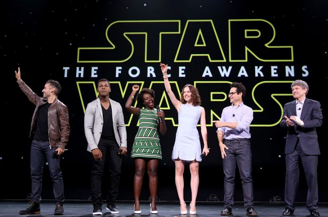 ANAHEIM, CA - AUGUST 15:  (L-R) Actors Oscar Isaac, John Boyega, Lupita Nyong'o, Daisy Ridley, director J.J. Abrams of STAR WARS: THE FORCE AWAKENS and Chairman of the Walt Disney Studios Alan Horn took part today in "Worlds, Galaxies, and Universes: Live Action at The Walt Disney Studios" presentation at Disney's D23 EXPO 2015 in Anaheim, Calif.  (Photo by Jesse Grant/Getty Images for Disney)